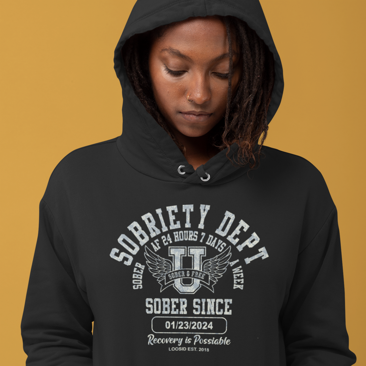 Woman wearing a sober merch hoodie
