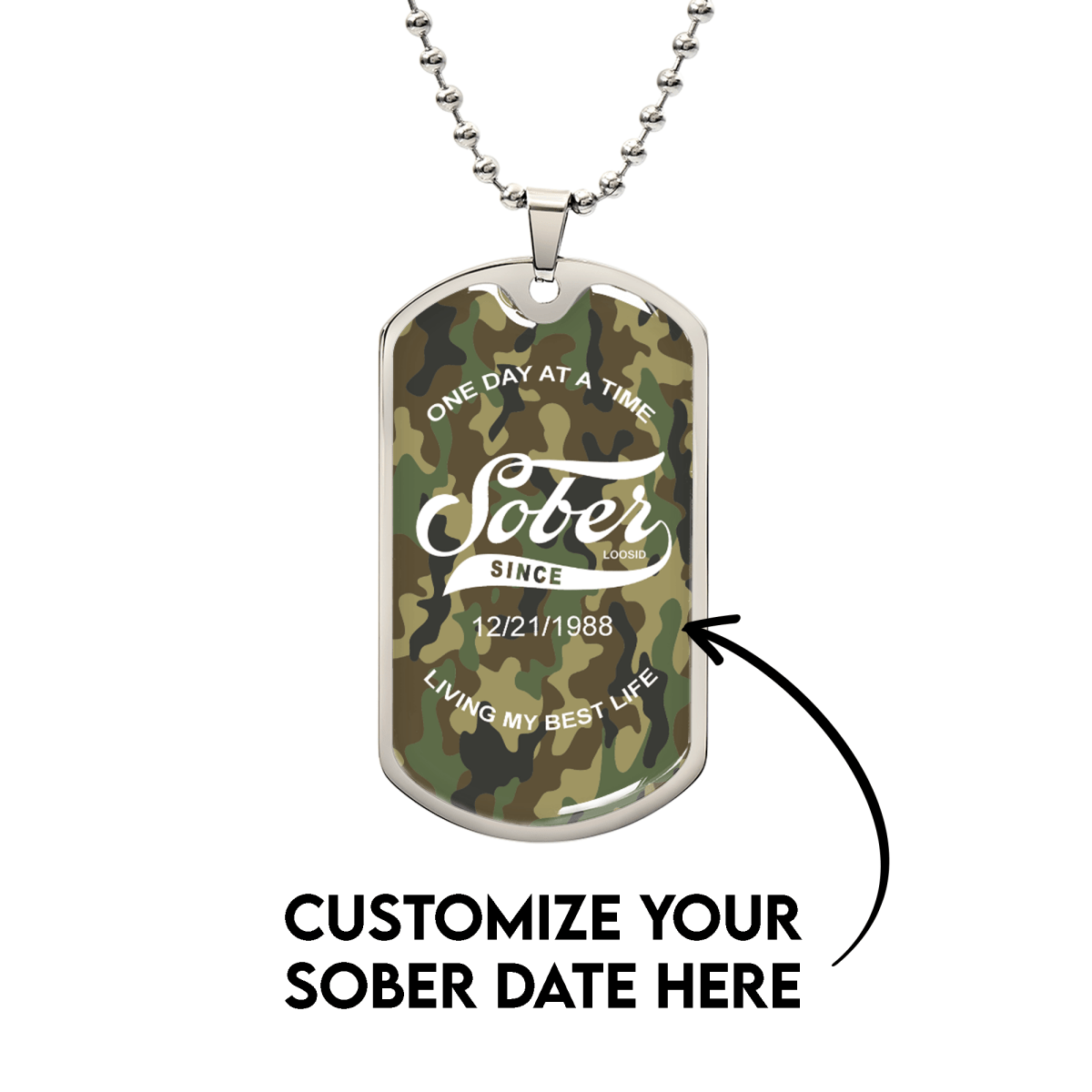 Close-up of camo Sobriety Gift dog tag engraved with One Day at a Time