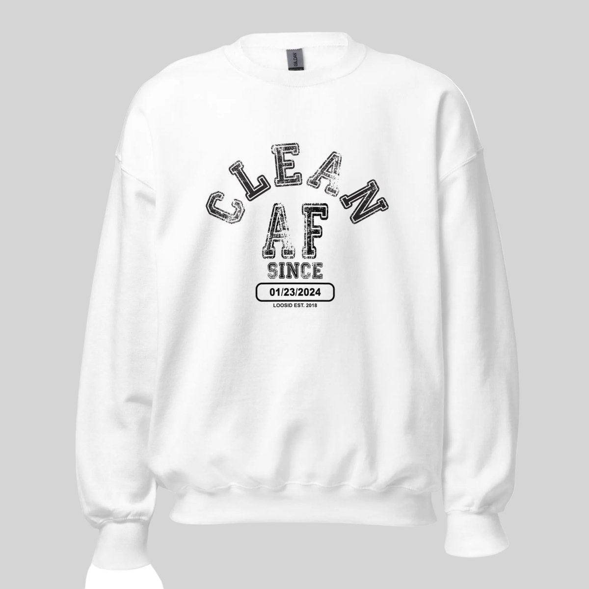 Flat lay of Loosid natural Clean AF Since sober apparel crewneck highlighting personalized Recovery date area β Loosid