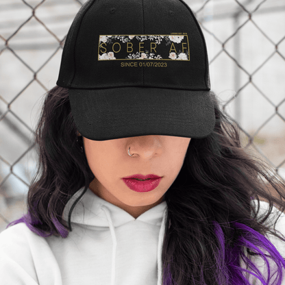 Woman wearing a custom embroidered Sobriety Hat outdoors
