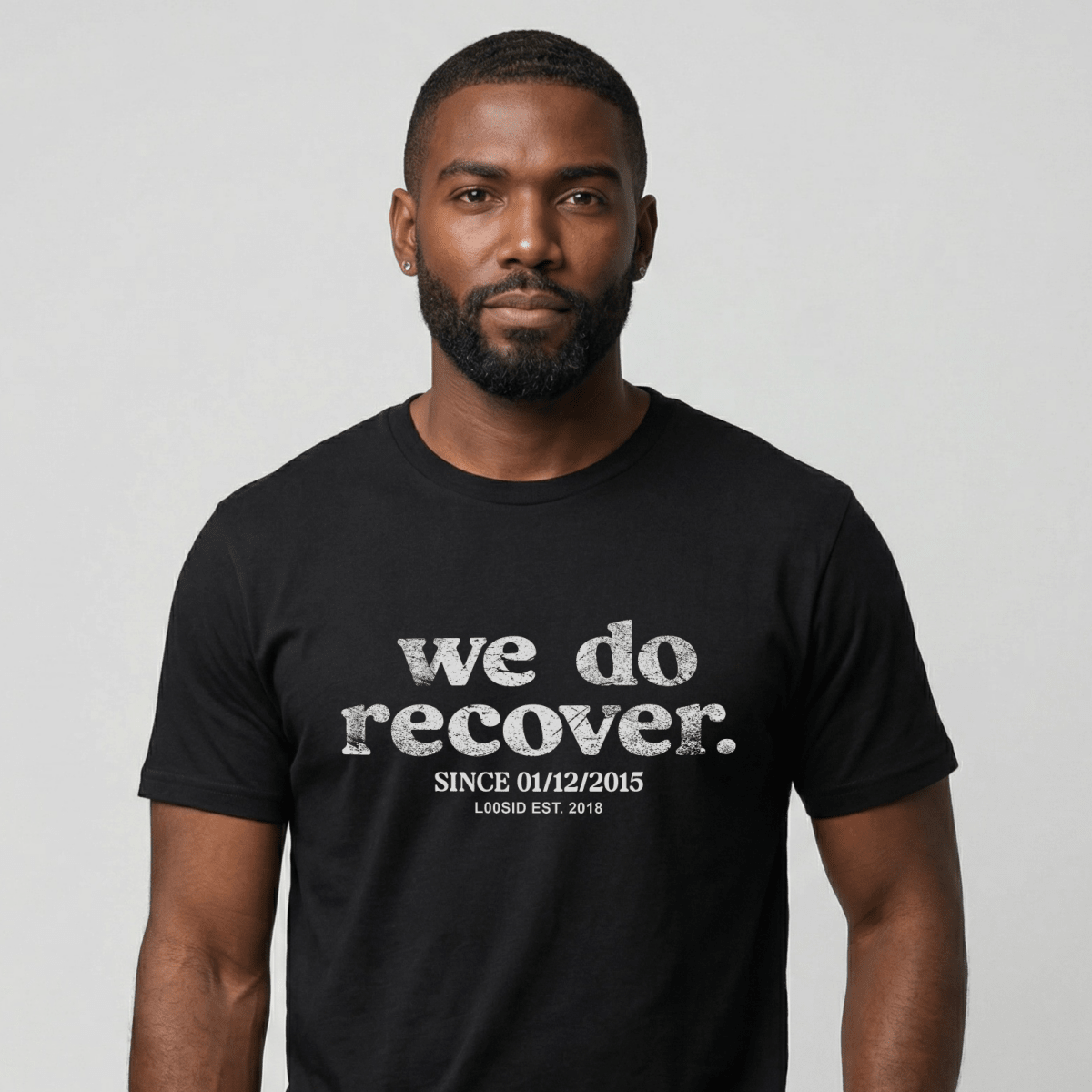 Man wearing black We Do Recover Sober T Shirt with personalized sobriety date by Loosid 