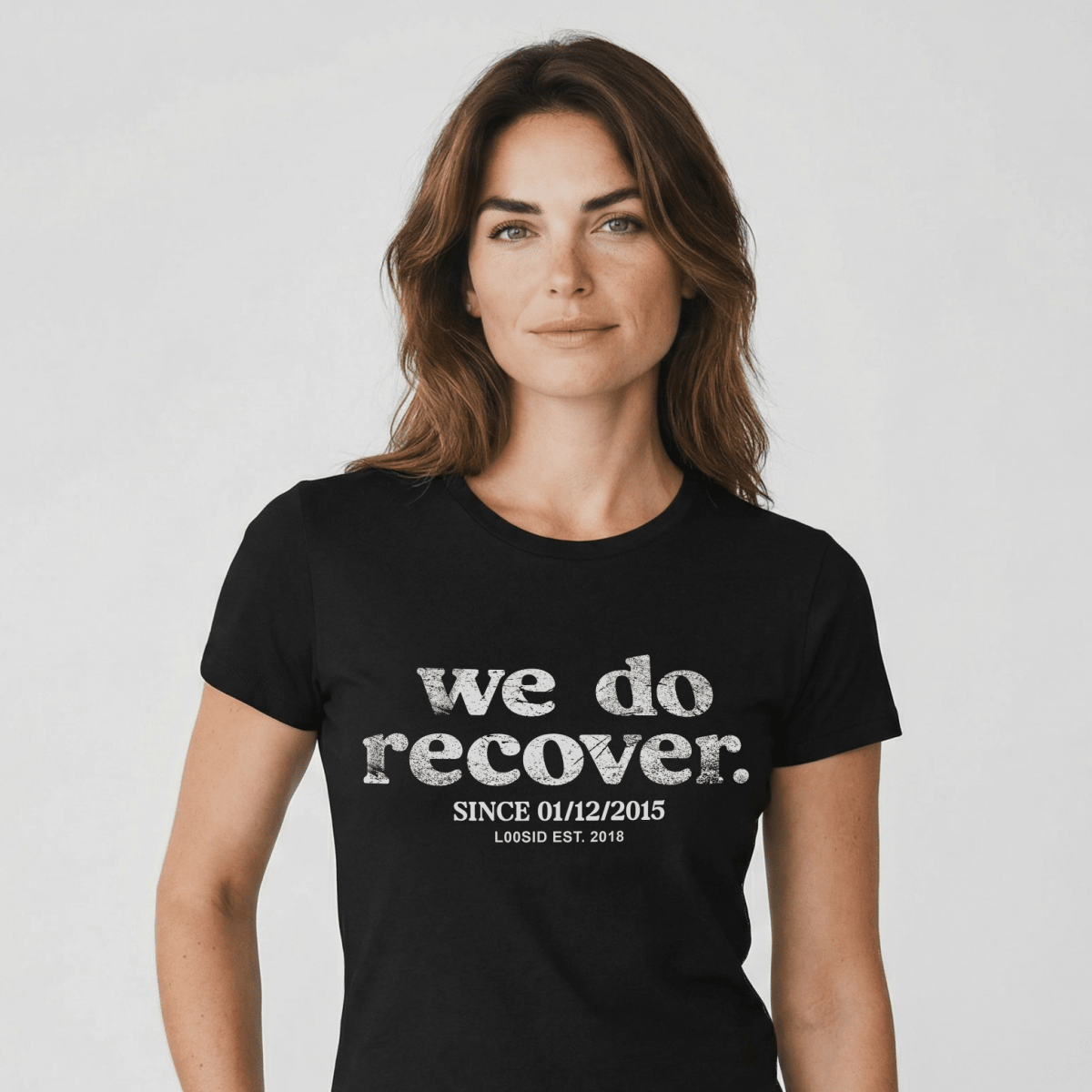 Woman wearing black We Do Recover Women's Sober T Shirt with personalized sobriety date by Loosid (hero image)