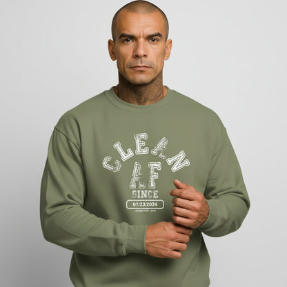 Flat lay of Loosid olive green Clean AF Since personalized sobriety gift crewneck sweatshirt — Loosid